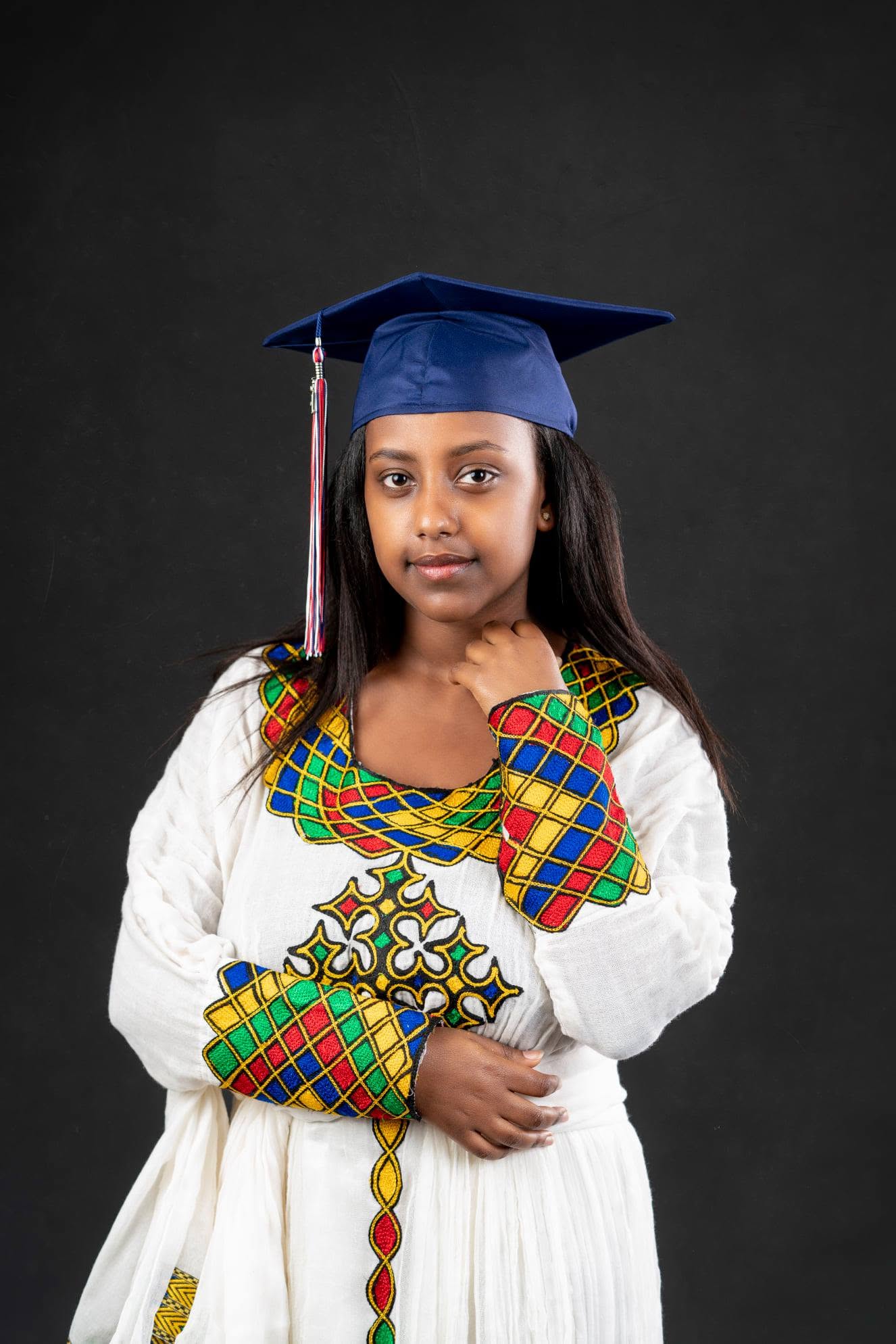 Young graduate in cap and traditional dress