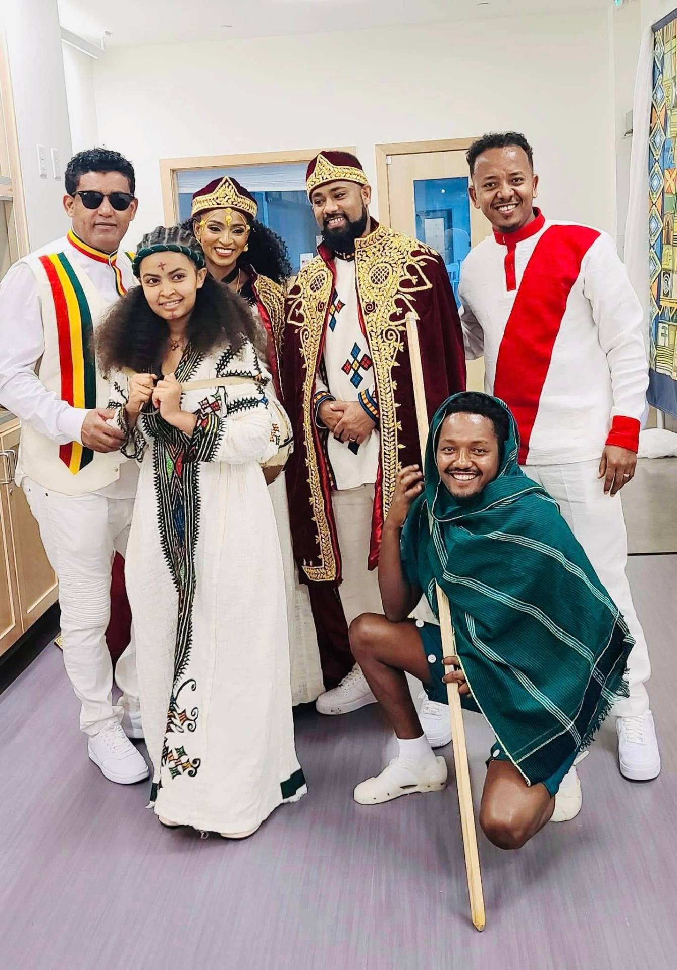 Friends in cultural habesha attire at a celebration