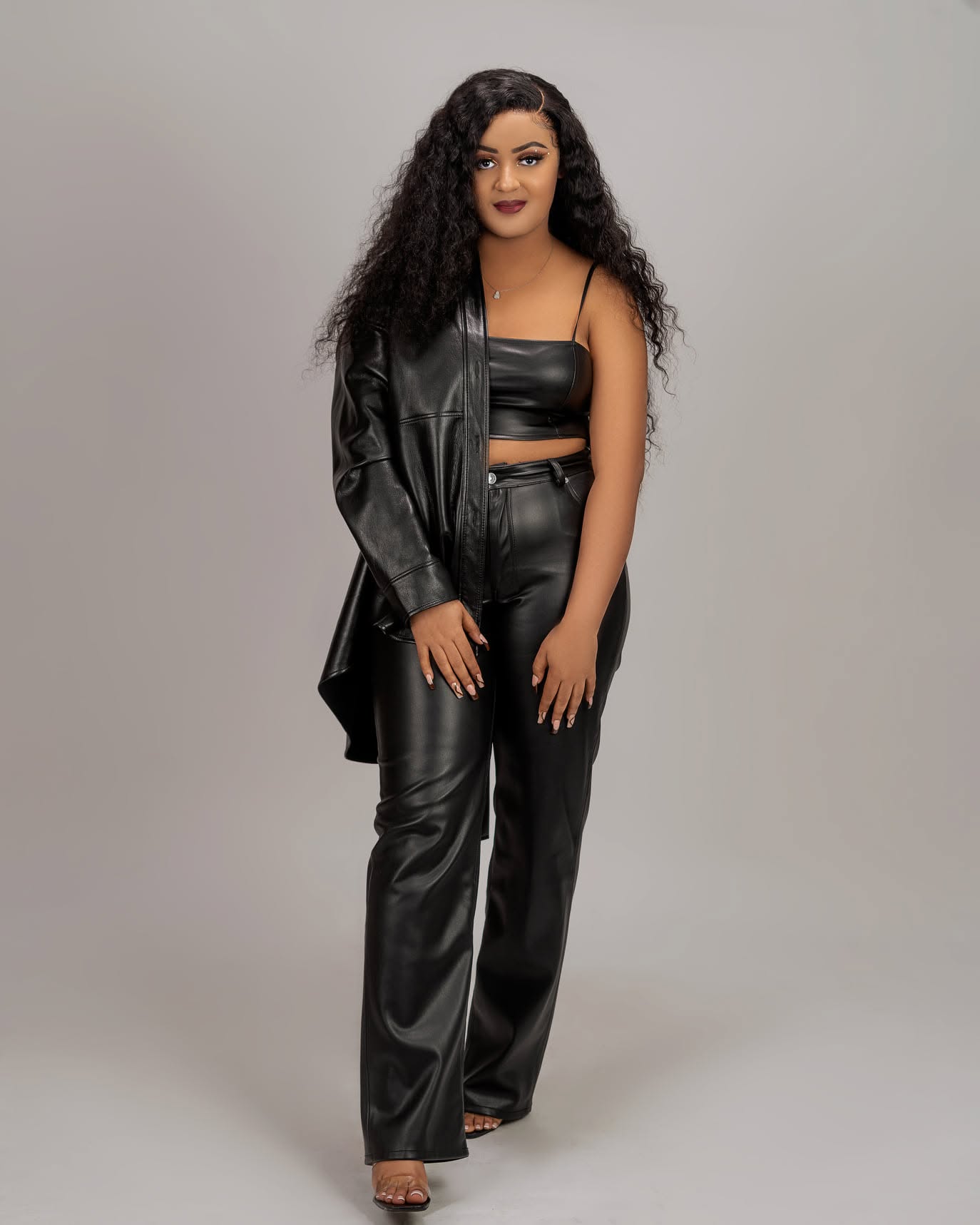 Studio fashion portrait in a black leather outfit