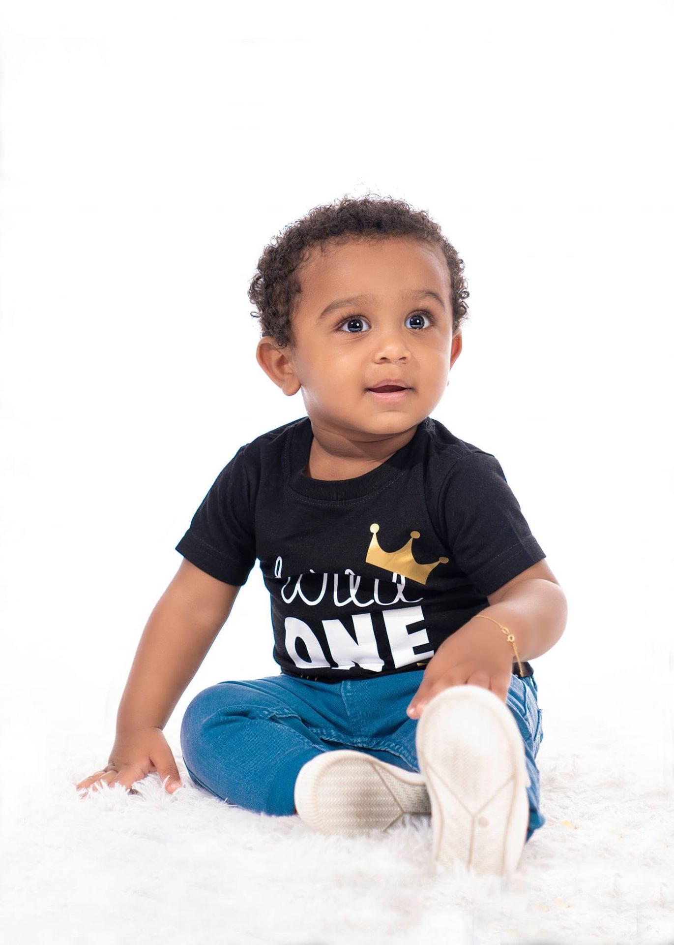 Baby boy celebrating his first birthday in studio